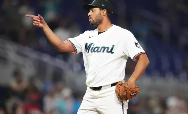 Miami Marlins relief pitcher Michael Petersen reacts after getting the final out during the ninth inning of a baseball game against the Cincinnati Reds, Wednesday, April 8, 2026, in Miami. (AP Photo/Lynne Sladky)