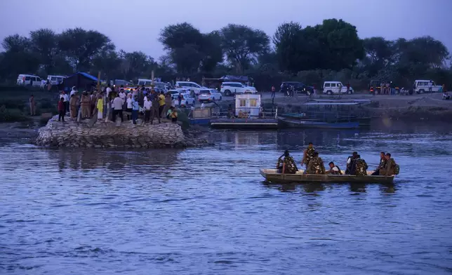Rescuers search the site where a boat carrying pilgrims capsized in the Yamuna river in Vrindavan, India, Friday, April 10, 2026. (AP Photo)