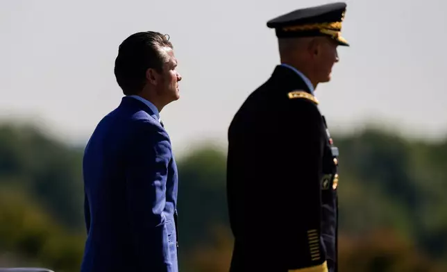 FILE - Defense Secretary Pete Hegseth, left, and Army Chief of Staff Gen. Randy George review troops during the POW/MIA National Recognition Day Ceremony at the Pentagon, Sept. 19, 2025, in Washington. (AP Photo/Julia Demaree Nikhinson, File)