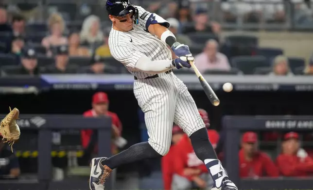 New York Yankees' Aaron Judge hits a home run during the sixth inning of a baseball game against the Los Angeles Angels, Monday, April 13, 2026, in New York. (AP Photo/Yuki Iwamura)
