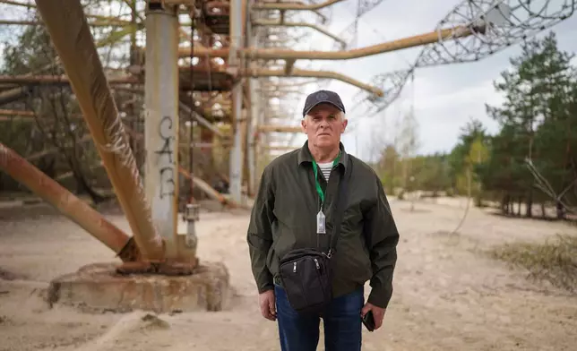 Oleksii Lebedynets, 65, who as a member of the military was sent to the Chernobyl nuclear power plant after the 1986 accident, poses for a portrait near the facility in Chernobyl, Ukraine, Tuesday, April 21, 2026. (AP Photo/Evgeniy Maloletka)