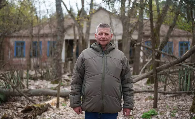 Anatolii Taranenko, 62, one of the workers sent to help clean up contamination from the Chernobyl nuclear power plant accident, poses for a portrait near the facility in Chernobyl, Ukraine, Tuesday, April 21, 2026. (AP Photo/Evgeniy Maloletka)