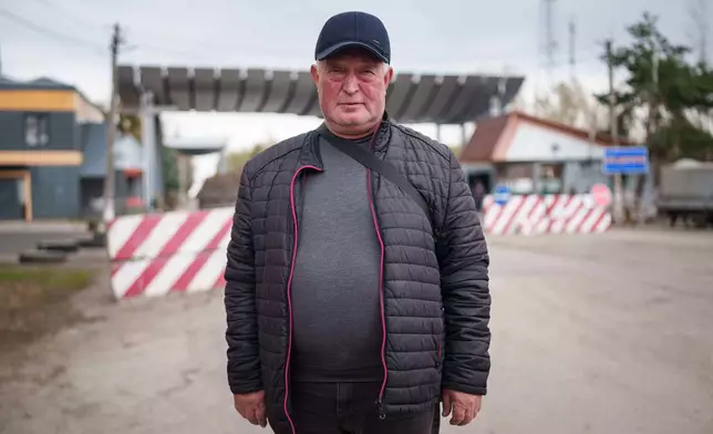 Serhii Buriak, 60, who helped guard abandoned buildings after the 1986 Chernobyl nuclear accident, poses for a portrait near the plant in Chernobyl, Ukraine, Tuesday, April 21, 2026. (AP Photo/Evgeniy Maloletka)