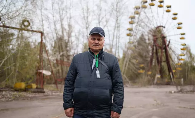 Volodymyr Vechirko, 62, one of the workers who helped decontaminate the area around the Chernobyl nuclear power plant after the 1986 accident, poses for a portrait in the nearby abandoned town of Prypiat, Ukraine, Tuesday, April 21, 2026. (AP Photo/Evgeniy Maloletka)