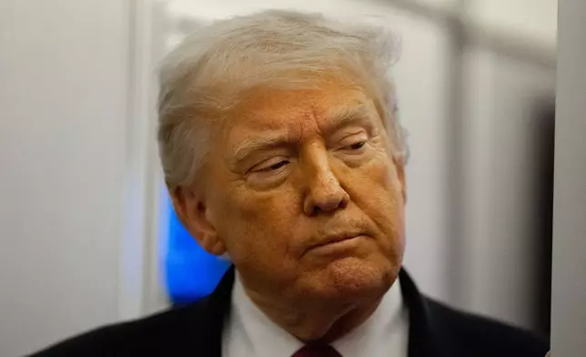 President Donald Trump speaks with reporters while in flight aboard Air Force One, Friday, April 17, 2026, while in route to Joint Base Andrews, Md. (AP Photo/Alex Brandon)