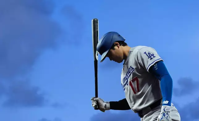 Los Angeles Dodgers' Shohei Ohtani waits for his at-bat against the San Francisco Giants during the fifth inning of a baseball game Tuesday, April 21, 2026, in San Francisco. (AP Photo/Godofredo A. Vásquez)