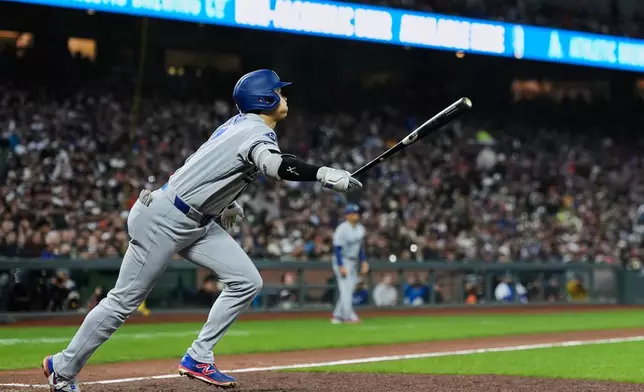 Los Angeles Dodgers' Shohei Ohtani watches his fly ball hit to San Francisco Giants center fielder Drew Gilbert for an out during the fifth inning of a baseball game Tuesday, April 21, 2026, in San Francisco. (AP Photo/Godofredo A. Vásquez)