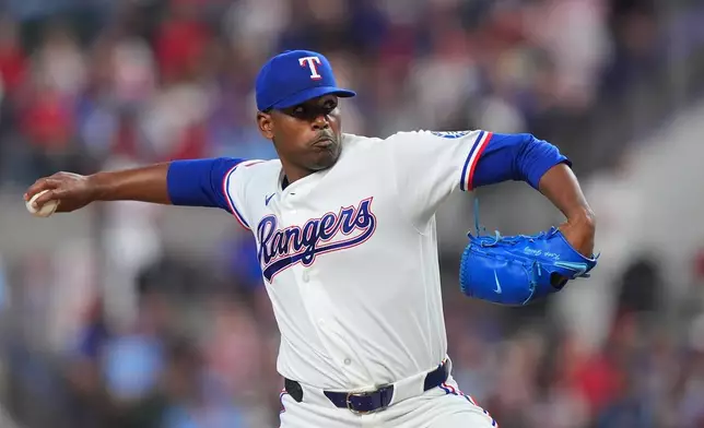 Texas Rangers starting pitcher Kumar Rocker throws during the first inning of a baseball game against the Cincinnati Reds, Saturday, April 4, 2026, in Arlington, Texas. (AP Photo/LM Otero)
