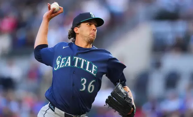Seattle Mariners starting pitcher Logan Gilbert throws a pitch to the Texas Rangers during the first inning of a baseball game Monday, April 6, 2026, in Arlington, Texas. (AP Photo/Julio Cortez)