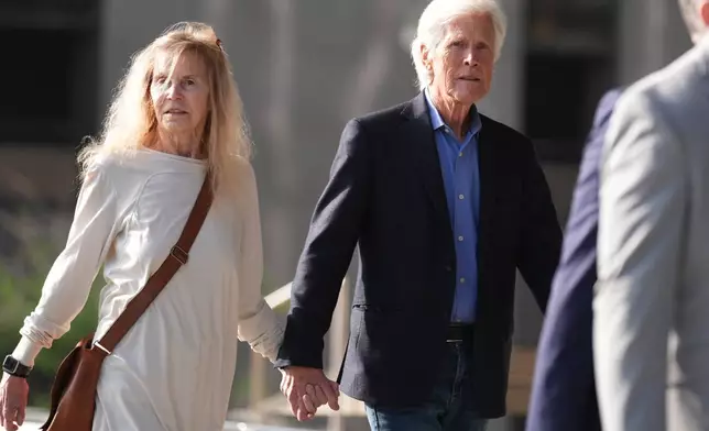 Suzanne Morrison, mother of Matthew Perry, walks into court with her husband Keith Morrison before Jasveen Sangha, who plead guilty to selling Perry a lethal dose of the drug ketamine in the days before his death, appears in court for sentencing on Wednesday, April 8, 2026 in Los Angeles. (AP Photo/Damian Dovarganes)