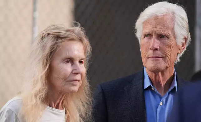 Suzanne Morrison, mother of Matthew Perry, walks into court with her husband Keith Morrison before Jasveen Sangha, who plead guilty to selling Perry a lethal dose of the drug ketamine in the days before his death, appears in court for sentencing on Wednesday, April 8, 2026 in Los Angeles. (AP Photo/Damian Dovarganes)