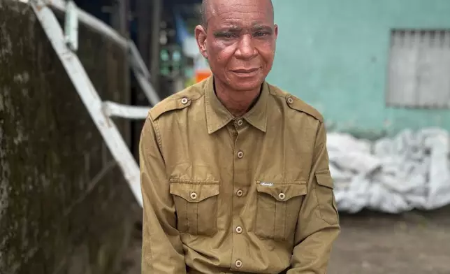 Paul Kasonga, a Kimbanguist pastor from the province of Mongala, poses at a reception center for the faithful in Kinshasa, Democratic Republic of the Congo, Sunday, April 5, 2026. (AP Photo/Rodney Muhumuza)