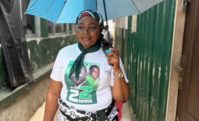 Chantal Makanga, a flutist who performs with the Kimbanguist Church choir, poses at a reception center for the faithful in Kinshasa, Democratic Republic of the Congo, Sunday, April 5, 2026. (AP Photo/Rodney Muhumuza)