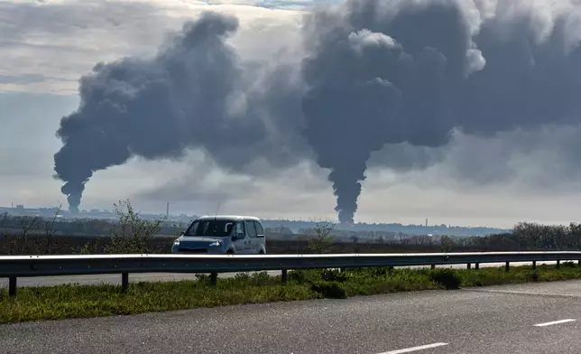 Smoke rises after a Russian strike in Dnipro, Ukraine, Saturday, April 25, 2026. (AP Photo/Mykola Synelnykov)