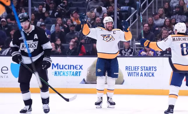 Nashville Predators' defenseman Roman Josi (5) celebrates his goal as Los Angeles Kings' Adrian Kempe (9) skates away during the third period of an NHL hockey game Monday, April 6, 2026, in Los Angeles. (AP Photo/Scott Strazzante)