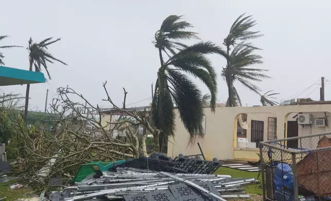 Debris covers the ground in Saipan on Wednesday, April 15, 2026, as a super typhoon with ferocious winds and relentless rains, shredded tin roofs and forced residents to take cover from flying tree limbs. (Office of the Mayor, municipality of Saipan via AP)