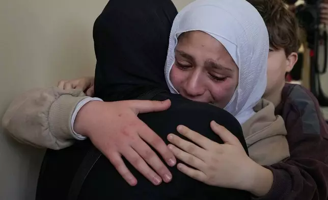 Relatives of Ghadir Baalbaki, 19, who was killed on Tuesday in an Israeli airstrike, mourn during her funeral in the southern port city of Tyre, Lebanon, Wednesday, April 15, 2026. (AP Photo/Hussein Malla)