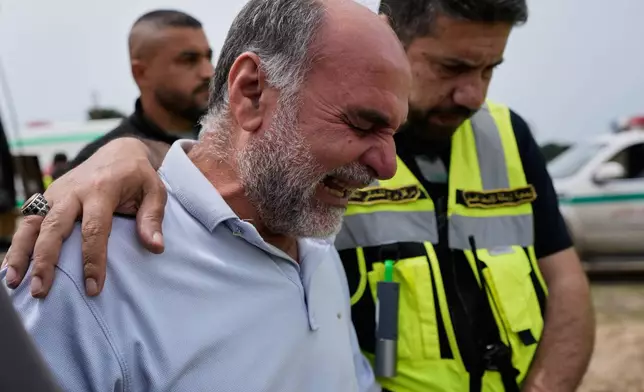 Mohammed, the father of Ghadir Baalbaki, 19, who was killed on Tuesday in an Israeli airstrike, mourns during her funeral in the southern port city of Tyre, Lebanon, Wednesday, April 15, 2026. (AP Photo/Hussein Malla)