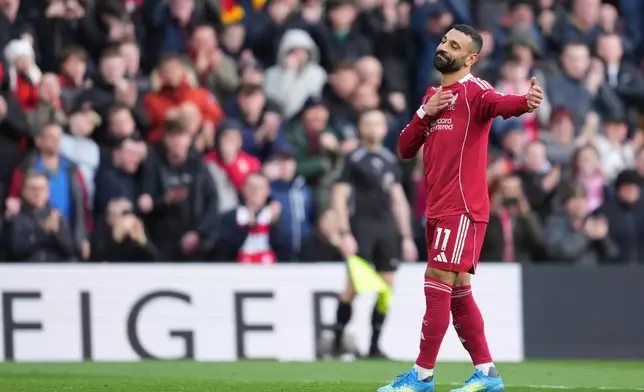 Liverpool's Mohamed Salah celebrates after scoring his side's second goal during the English Premier League soccer match between Liverpool and Fulham in Liverpool, England, Saturday, April 11, 2026. (AP Photo/Jon Super)