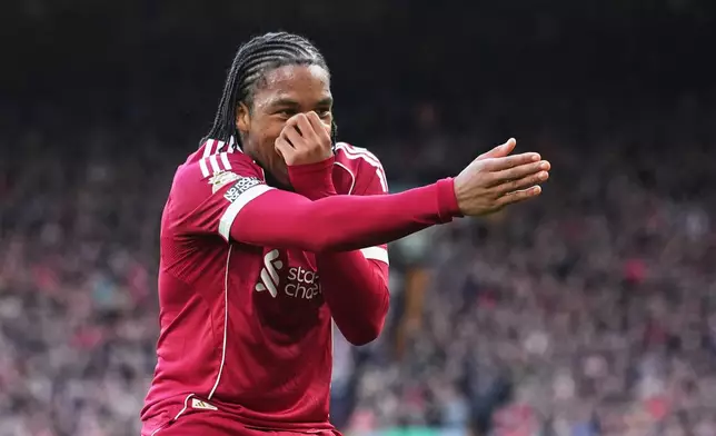 Liverpool's Rio Ngumoha celebrates after scoring his side's opening goal during the English Premier League soccer match between Liverpool and Fulham in Liverpool, England, Saturday, April 11, 2026. (AP Photo/Jon Super)