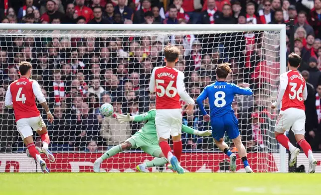 Bournemouth's Alex Scott scores his side's second goal of the game during the English Premier League soccer match between Arsenal and Bournemouth in London, England Saturday, April 11, 2026. (Adam Davy/PA via AP)