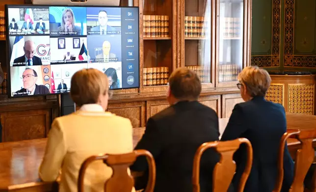 Britain's Foreign Secretary Yvette Cooper, right, attends a virtual summit at the Foreign &amp; Commonwealth Office in London, on Thursday April 2, 2026, with around 35 countries to discuss ways of reopening the Strait of Hormuz. (Leon Neal/Pool Photo via AP)
