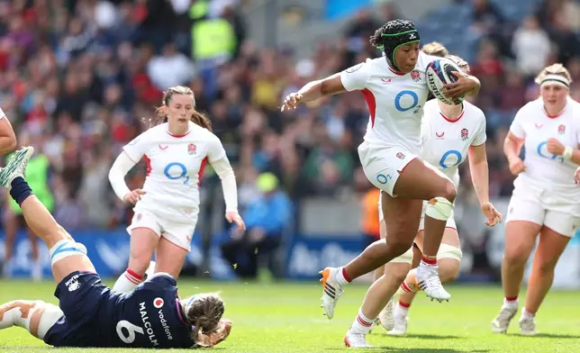 England's Sadia Kabeya breaks from Scotland's Rachel Malcolm during the Women's Six Nations rugby match between Scotland and England in Edinburgh, Scotland, Saturday April 18, 2026. (Ewan Bootman/PA via AP)