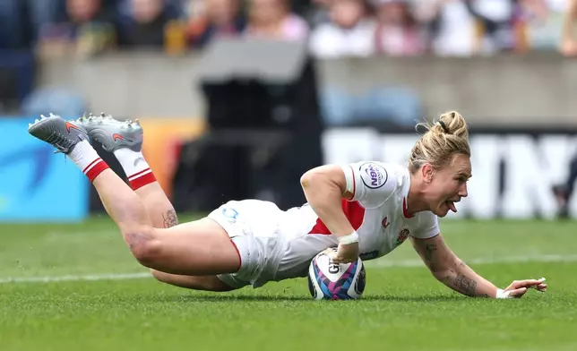 England's Megan Jones scores a try during the Women's Six Nations rugby match between Scotland and England in Edinburgh, Scotland, Saturday April 18, 2026. (Ewan Bootman/PA via AP)
