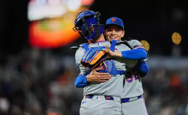 New York Mets pitcher Tobias Myers, right, and catcher Luis Torrens celebrate after the team's victory over the San Francisco Giants in a baseball game Saturday, April 4, 2026, in San Francisco. (AP Photo/Godofredo A. Vásquez)