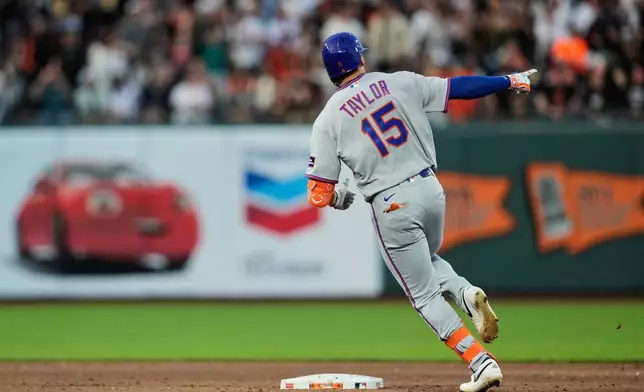 New York Mets' Tyrone Taylor runs the bases after hitting a three-run home run during the fifth inning of a baseball game against the San Francisco Giants, Saturday, April 4, 2026, in San Francisco. (AP Photo/Godofredo A. Vásquez)