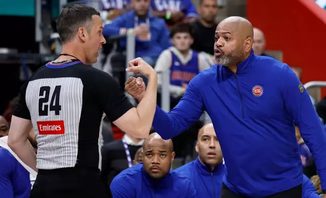 Detroit Pistons head coach J.B. Bickerstaff, right, argues with referee Kevin Scott (24) during the first half in Game 1 against the Orlando Magic in a first-round NBA basketball playoffs series Sunday, April 19, 2026, in Detroit. (AP Photo/Duane Burleson)
