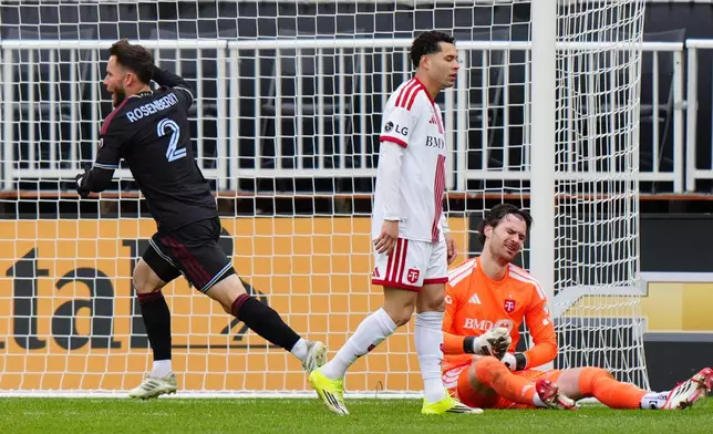 Colorado Rapids defender Keegan Rosenberry (2) celebrates his goal as Toronto FC defender Matheus Pereira and FC goalkeeper Luka Gavran (1) react during the second half of an MLS soccer game in Toronto, Saturday, April 4, 2026. (Frank Gunn/The Canadian Press via AP)