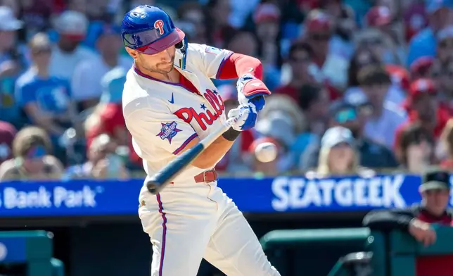 Philadelphia Phillies' Trea Turner hits a home run during the sixth inning of a baseball game against the Arizona Diamondbacks, Sunday, April 12, 2026, in Philadelphia. (AP Photo/Laurence Kesterson)
