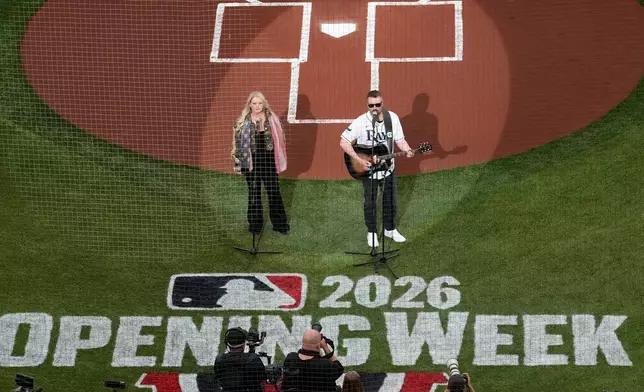 Country musician Eric Church sings the National Anthem before a baseball game between the Tampa Bay Rays and the Chicago Cubs Monday, April 6, 2026, in St. Petersburg, Fla. (AP Photo/Chris O'Meara)