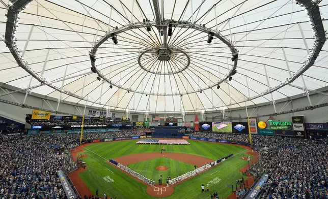 Players from the Chicago Cubs and Tampa Bay Rays are introduced before a baseball game Monday, April 6, 2026, in St. Petersburg, Fla. (AP Photo/Chris O'Meara)