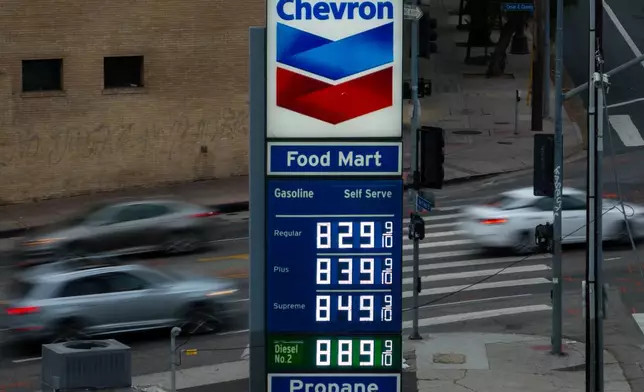 Gas prices are displayed at a Chevron gas station, in downtown Los Angeles, Tuesday, March 31, 2026. (AP Photo/Jae C. Hong)