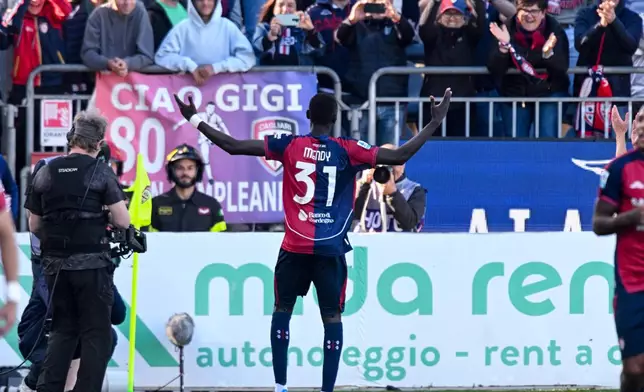 Cagliari's Paul Mendy celebrates after scoring during the Serie A soccer match between Cagliari and Atalanta, in Cagliari, Italy, Monday, April 27. (Gianluca Zuddas/LaPresse via AP)