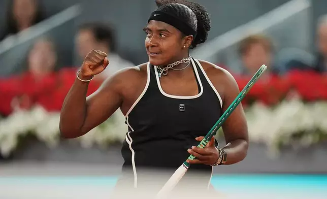 Hailey Baptiste, of the United States, celebrates a point during her match against Aryna Sabalenka, of Belarus, at the Madrid Open tennis tournament in Madrid, Tuesday, April 28, 2026. (AP Photo/Manu Fernandez)