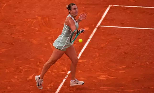 Aryna Sabalenka of Belarus returns the ball to Hailey Baptiste of the U.S. during the Madrid Open tennis tournament in Madrid, Tuesday, April 28, 2026. (AP Photo/Manu Fernandez)