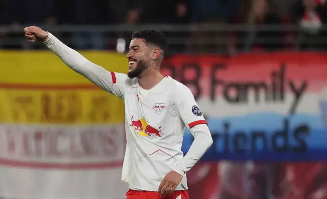 RB Leipzig's Romulo celebrates scoring a goal during a Bundesliga soccer match between RB Leipzig and 1. FC Union Berlin, Friday, April 24, 2026, in Leipzig, Germany. (Jan Woitas/dpa via AP)