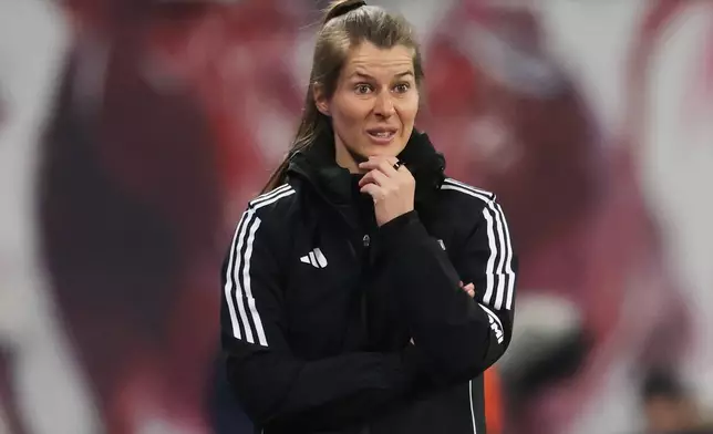 Union Berlin coach Marie-Louise Eta watches from the sideline during a Bundesliga soccer match between RB Leipzig and 1. FC Union Berlin, Friday, April 24, 2026, in Leipzig, Germany. (Jan Woitas/dpa via AP)
