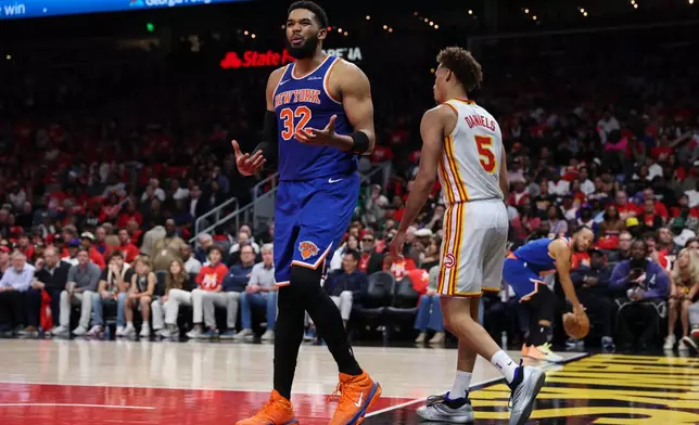 New York Knicks center Karl-Anthony Towns (32) reacts during the first half in Game 3 of a first-round NBA playoffs basketball series against the Atlanta Hawks, Thursday, April 23, 2026, in Atlanta. (AP Photo/Colin Hubbard)