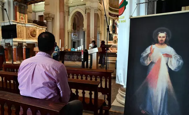 A man sits inside the Basilica of Saint Augustine in Annaba, eastern Algeria, Saturday, April 11, 2026, ahead of Pope Leo XIV's visit. (AP Photo/Fateh Guidoum)