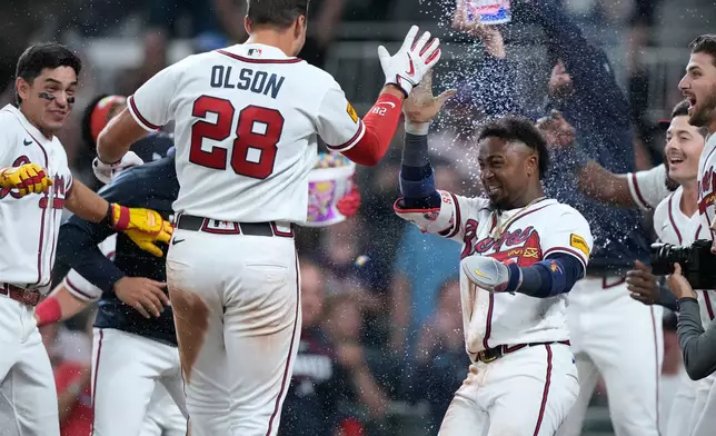 Atlanta Braves' Matt Olson (28) celebrates hitting a walk-off two run home run in the ninth inning of a baseball game against the Detroit Tigers Wednesday, April 29, 2026, in Atlanta. (AP Photo/Brynn Anderson)