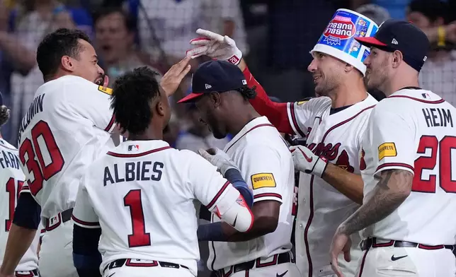 Atlanta Braves' Matt Olson (28) celebrates hitting a walk-off two run home run in the ninth inning of a baseball game against the Detroit Tigers Wednesday, April 29, 2026, in Atlanta. (AP Photo/Brynn Anderson)