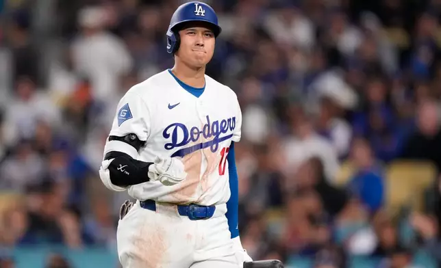 Los Angeles Dodgers' Shohei Ohtani walks away after striking out during the eighth inning of a baseball game against the Cleveland Guardians, Wednesday, April 1, 2026, in Los Angeles. (AP Photo/Mark J. Terrill)