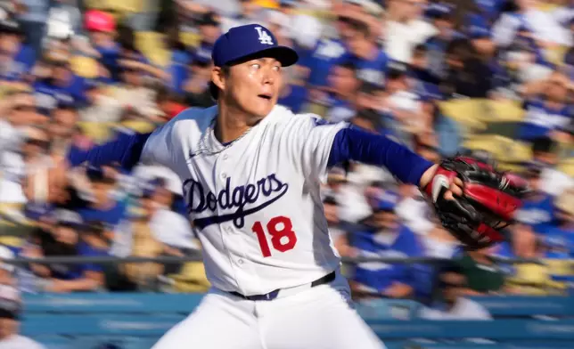 Los Angeles Dodgers starting pitcher Yoshinobu Yamamoto throws to the plate during the first inning of a baseball game against the Cleveland Guardians, Wednesday, April 1, 2026, in Los Angeles. (AP Photo/Mark J. Terrill)