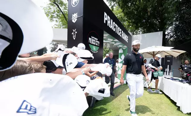 FILE - Captain Jon Rahm, of Legion XIII, makes his way to the course before the final round of LIV Golf Mexico City at Club de Golf Chapultepec, Sunday, April 19, 2026 in Naucalpan, Mexico. (Charles Laberge/LIV Golf via AP, File)