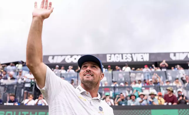 FILE - Captain Bryson DeChambeau, of Crushers GC, waves to the fans at the 17th tee during the third round of LIV Golf South Africa at The Club at Steyn City, Saturday, March 21, 2026 in Midrand, South Africa. (Pedro Salado/LIV Golf via AP, File)