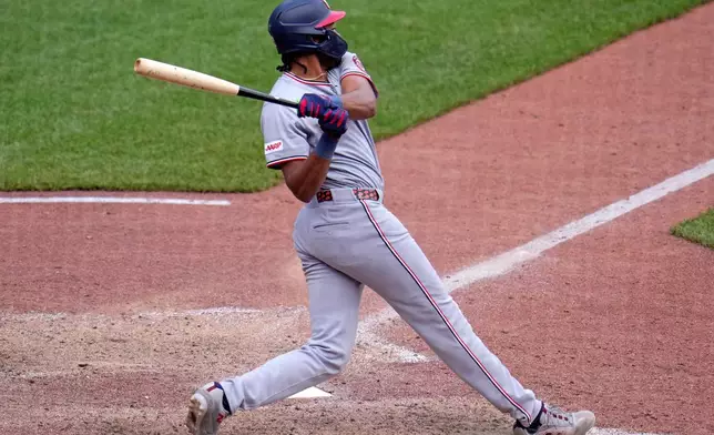 Washington Nationals' James Wood singles off Pittsburgh Pirates pitcher Dennis Santana, driving in a run, during the 10th inning of a baseball game in Pittsburgh, Thursday, April 16, 2026. (AP Photo/Gene J. Puskar)